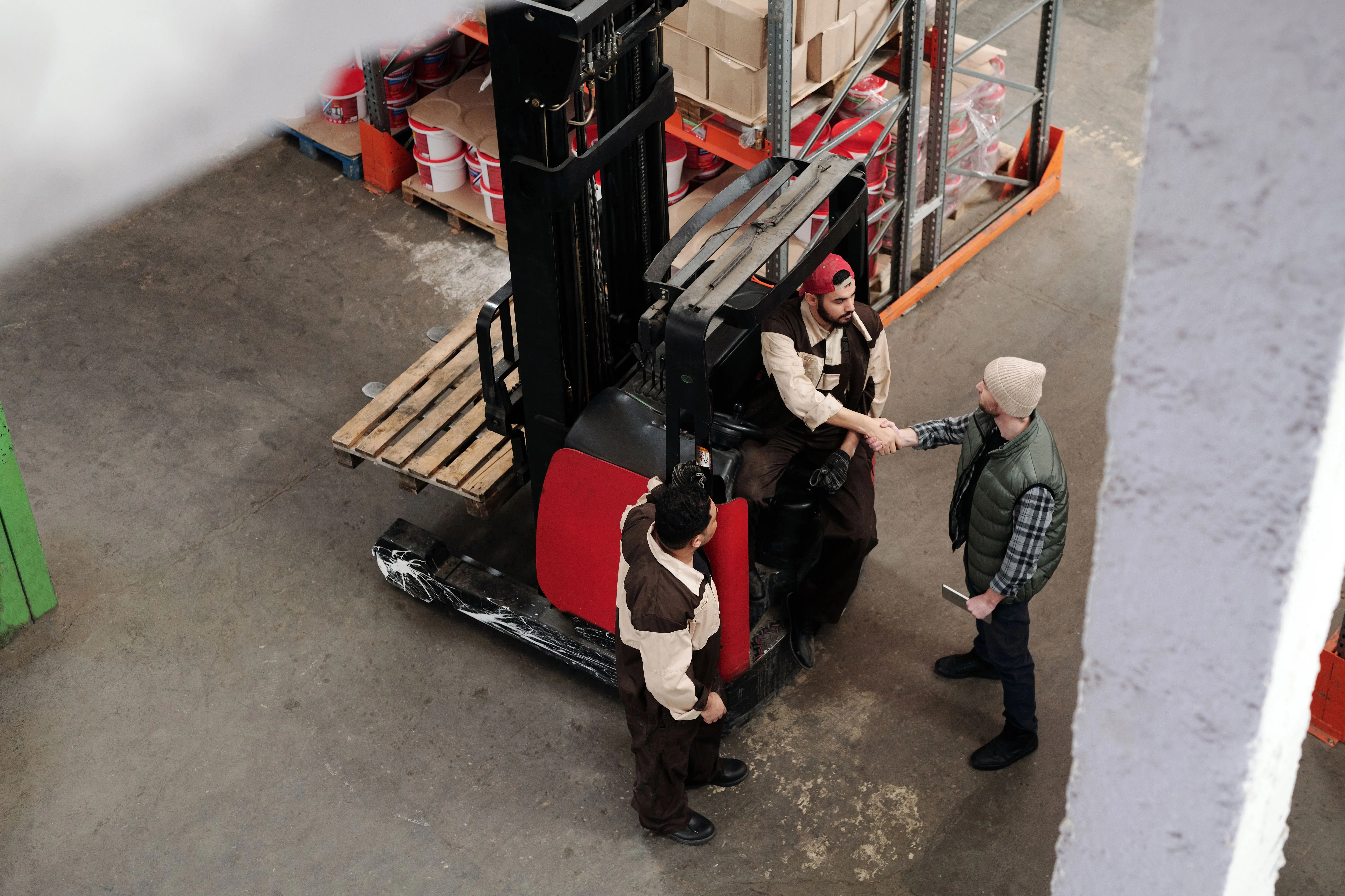 Forklift moving stock inside a warehouse
